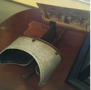 a vintage, portable stereoscope and stereoscopic slide